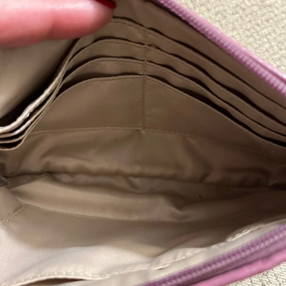 Coach wristlet.  EUC. Pinkish/mauve color.  Approximately 8.5 x 5.5